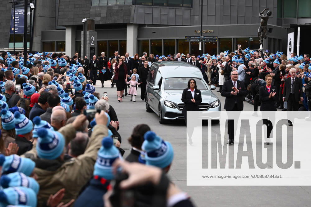 NEALE DANIHER STATE FUNERAL, Guests form a guard of honour as the hearse departs the State Funeral Service for Neale Daniher at the MCG, Melbourne, Wednesday, June 10, 2026. A state funeral will honour the life and extraordinary achievements of AFL great Neale Daniher, whose fight against MND inspired countless Australians. ( NO ARCHIVING MELBOURNE VICTORIA AUSTRALIA