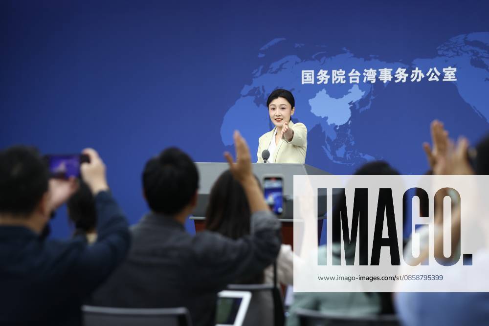 Zhang Han, spokesperson for the Taiwan Affairs Office of the State Council, gestures at a regular press conference on June 10, 2026 in Beijing, China.