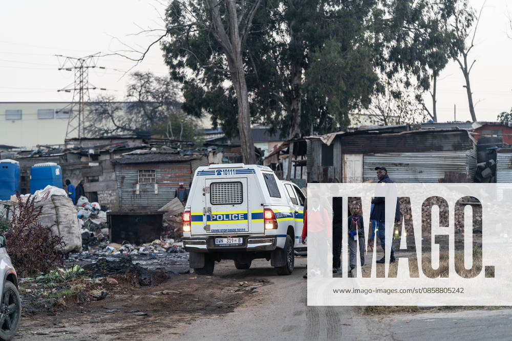 (260610) -- JOHANNESBURG, June 10, 2026 -- A police officer works at the scene of a shooting incident in Cleveland, Johannesburg, South Africa, June 10, 2026. At least 12 people were killed and nine others injured in a mass shooting at an informal settlement in Johannesburg, South Africa s largest city, police said on Wednesday. (Photo by Shiraaz Mohamed Xinhua) SOUTH AFRICA-JOHANNESBURG-SHOOTING INCIDENT ChenxWei