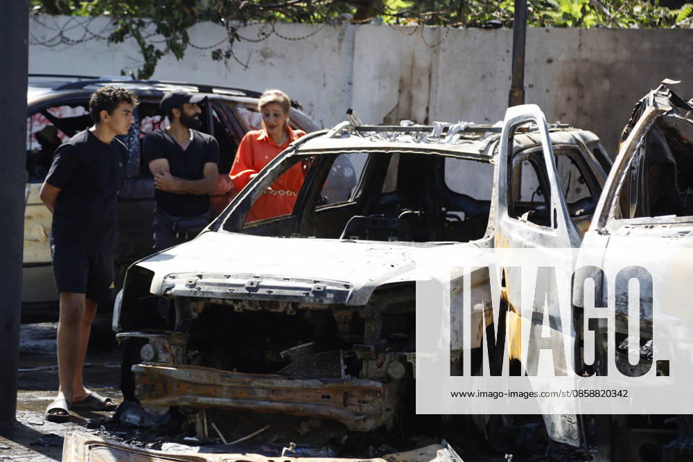 An Israeli drone strike targeted a van in the Al-Bawaba Al-Fawqa area adjacent to the commercial market in central Sidon (Saida), southern Lebanon, killing two people and igniting a fire that spread to several nearby vehicles. The attack occurred near the Maronite Church and a fuel station in a densely populated civilian area. Emergency responders and civil defense teams recovered the victims and worked to extinguish the blaze, which damaged at least four neighboring cars. Saida lebanon - ZUMAb339 20260610_znp_b339_001