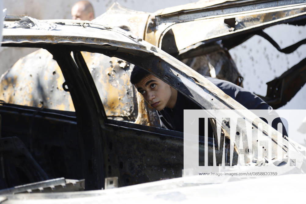 An Israeli drone strike targeted a van in the Al-Bawaba Al-Fawqa area adjacent to the commercial market in central Sidon (Saida), southern Lebanon, killing two people and igniting a fire that spread to several nearby vehicles. The attack occurred near the Maronite Church and a fuel station in a densely populated civilian area. Emergency responders and civil defense teams recovered the victims and worked to extinguish the blaze, which damaged at least four neighboring cars. Saida lebanon - ZUMAb339 20260610_znp_b339_005