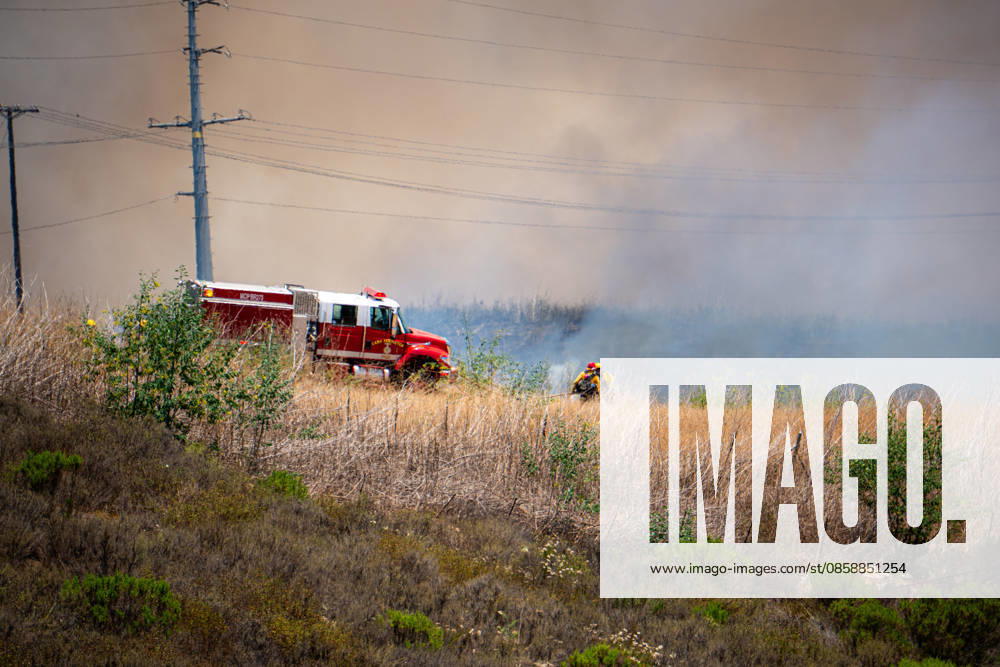 Fire crews battle the November Fire off Foussat Rd. in Oceanside, California, on June 10, 2026. Multiple resources were called to subdue the nearly 850 acre fire that borders Camp Pendleton and the Whelan Lake Audubon Society Preserve. Oceanside USA - ZUMAg219 20260610_znp_g219_006
