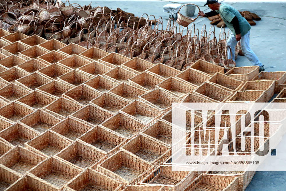Workers dry woven willow products on June 10, 2026 in Linshu, Shandong Province of China. Linshu County has developed a full industrial chain for willow weaving, with products exported to over 80 countries and regions including Europe, the United States, Japan, South Korea and Southeast Asia.