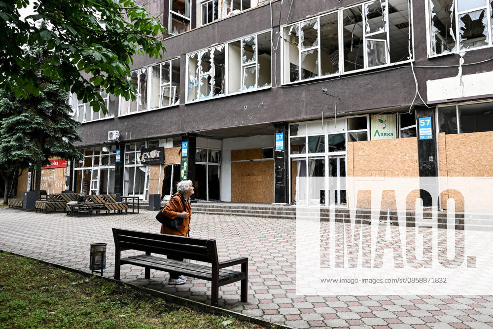A resident of frontline Kherson looks at a damaged building in the city’s red zone, the area considered the most dangerous due to constant Russian attacks, Kherson, Ukraine, on June 3, 2026. The Russian army attacks the city daily with FPV drones and other unmanned aerial vehicles, deliberately terrorizing civilians. Russian forces conduct hunts for local residents, tracking them with FPV drones and dropping explosives. Police officers, medics, public transport, and urban infrastructure are also targeted. Based on the intensity of attacks, Kherson is informally divided into yellow and red zones, with the red zone subjected to continuous shelling and drone strikes. Anti-drone netting has been installed above roads to help protect a