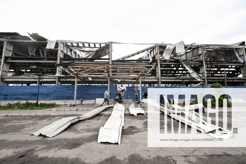 Workers clear debris at the site of the Favoryt Arena ice sports palace, destroyed in Russian guided aerial bomb (KAB) strikes, in the frontline city of Kherson, Ukraine, on June 3, 2026. The Russian army attacks the city daily with FPV drones and other unmanned aerial vehicles, deliberately terrorizing civilians. Russian forces conduct hunts for local residents, tracking them with FPV drones and _drop_ping explosives. Police officers, medics, public transport, and urban infrastructure are also targeted. (Photo by Dmytro Smolienko Ukrinform) Life under shelling in frontline Kherson