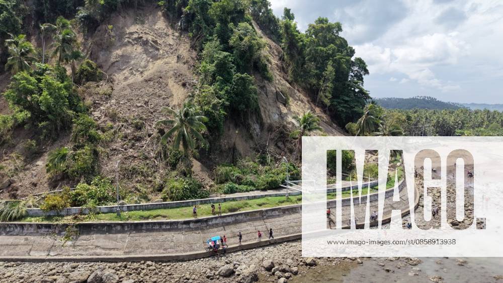 (260611) -- GENERAL SANTOS CITY, June 11, 2026 -- People struggle beside a blocked road after a major landslide triggered by an earthquake, in Sarangani Province, the Philippines, June 11, 2026. At least 47 people were killed, 31 missing and 688 injured after a magnitude 7.8 earthquake struck off the southern coast of Mindanao, the Philippines, on Monday, said the National Disaster Risk Reduction and Management Council (NDRRMC) on Thursday. (Str Xinhua) PHILIPPINES-SARANGANI PROVINCE-EARTHQUAKE-AFTERMATH RouellexUmali