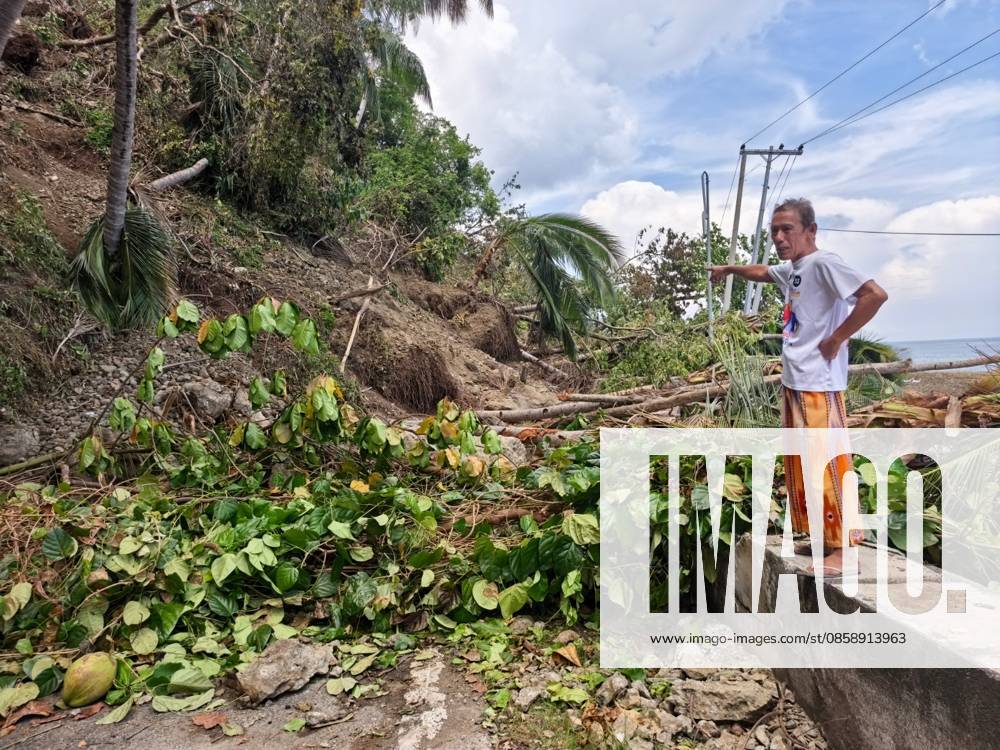 (260611) -- GENERAL SANTOS CITY, June 11, 2026 -- A man stands by the roadside of a blocked road after a major landslide triggered by an earthquake, in Sarangani Province, the Philippines, June 11, 2026. At least 47 people were killed, 31 missing and 688 injured after a magnitude 7.8 earthquake struck off the southern coast of Mindanao, the Philippines, on Monday, said the National Disaster Risk Reduction and Management Council (NDRRMC) on Thursday. (Str Xinhua) PHILIPPINES-SARANGANI PROVINCE-EARTHQUAKE-AFTERMATH RouellexUmali