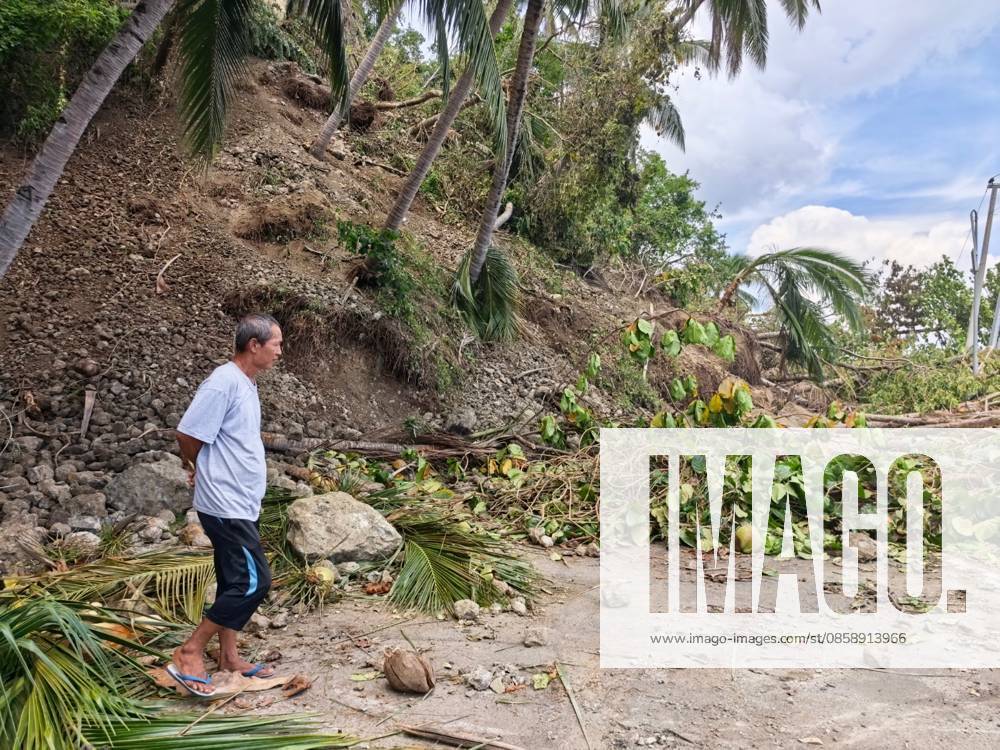 (260611) -- GENERAL SANTOS CITY, June 11, 2026 -- A man stands on a blocked road after a major landslide triggered by an earthquake, in Sarangani Province, the Philippines, June 11, 2026. At least 47 people were killed, 31 missing and 688 injured after a magnitude 7.8 earthquake struck off the southern coast of Mindanao, the Philippines, on Monday, said the National Disaster Risk Reduction and Management Council (NDRRMC) on Thursday. (Str Xinhua) PHILIPPINES-SARANGANI PROVINCE-EARTHQUAKE-AFTERMATH RouellexUmali