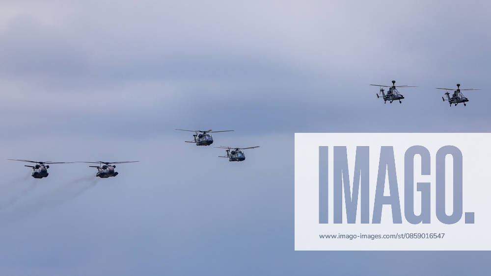 Trade visitor day at ILA Berlin 2026, Berlin, 12 06 2026 Six military helicopters flying in formation through overcast skies Both NH90 transport helicopters and Eurocopter Tiger combat helicopters in camouflage livery can be seen Schöneberg Berlin ExpoCenter Airport Brandenburg Germany 20260612-1V9A1623-M4000