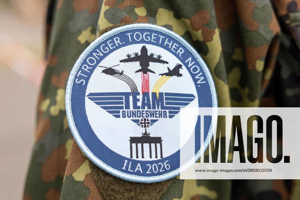 Trade visitor day at ILA Berlin 2026, Berlin, 12 06 2026 Close-up of a round Bundeswehr patch on a spot camouflage uniform sleeve The badge with the inscription Team Bundeswehr and ILA 2026 shows silhouettes of military aircraft over the Brandenburg Gate and the words Stronger Together Now Schöneberg Berlin ExpoCenter Airport Brandenburg Germany 20260612-286A9793-M4000