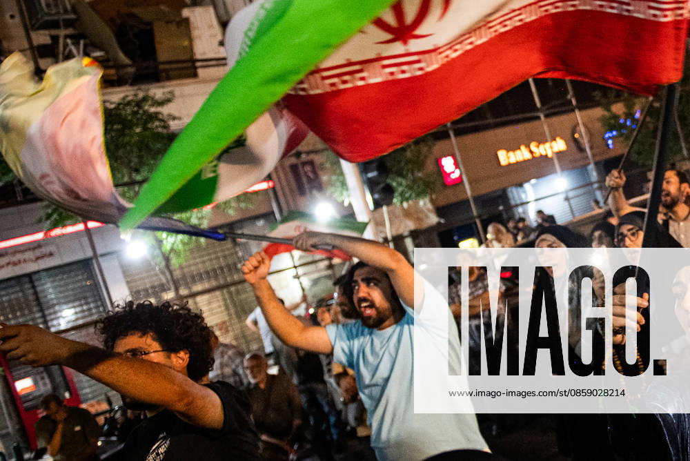 Iranians rally , waving flags in support of the government s negotiations to end the war with the United States, Anti?U.S. and anti?Israel chants echoed at Enghelab Square in Tehran late Friday, June 12, 2026. IRN2026061201 BehnamxTofighi