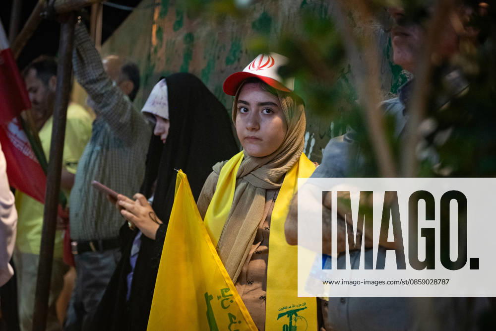 An Iranian girl carries of Hezbollah, the Lebanese group, is a key ally of Iran flag during a rally , as crowds wave flags in support of the government s negotiations to end the war with the United States. Anti?U.S. and anti?Israel chants echoed through Enghelab Square in Tehran late Friday, June 12, 2026. IRN2026061219 BehnamxTofighi