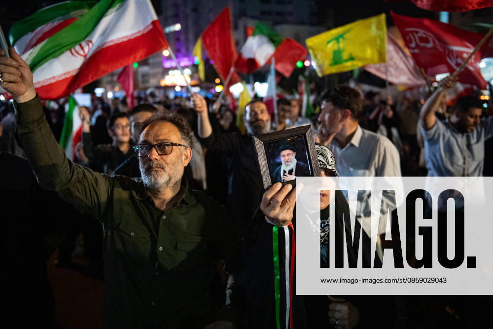 Iranians wave their National flag during a rally in support of the government s negotiations to end the war with the United States at Enghelab Square in Tehran, Iran on Friday, June 12, 2026. IRN2026061225 BehnamxTofighi