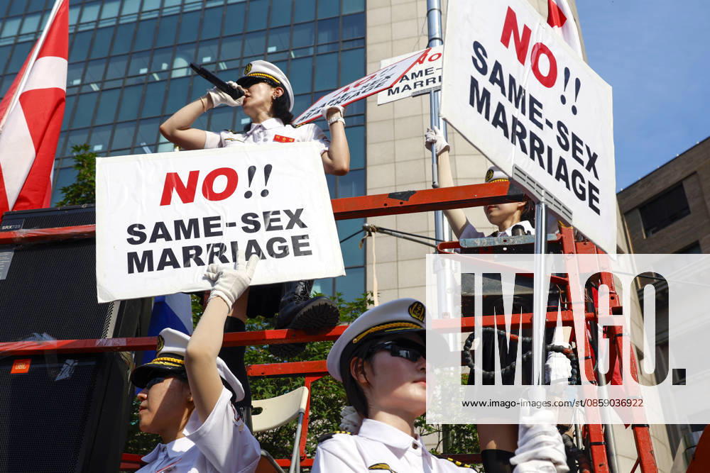 Annual LGBTQ Pride Parade held in central Seoul Conservative Christian protesters holding signs stage a counter-rally against the 27th Seoul Queer Parade in downtown Seoul, South Korea, on June 13, 2026. Seoul South Korea