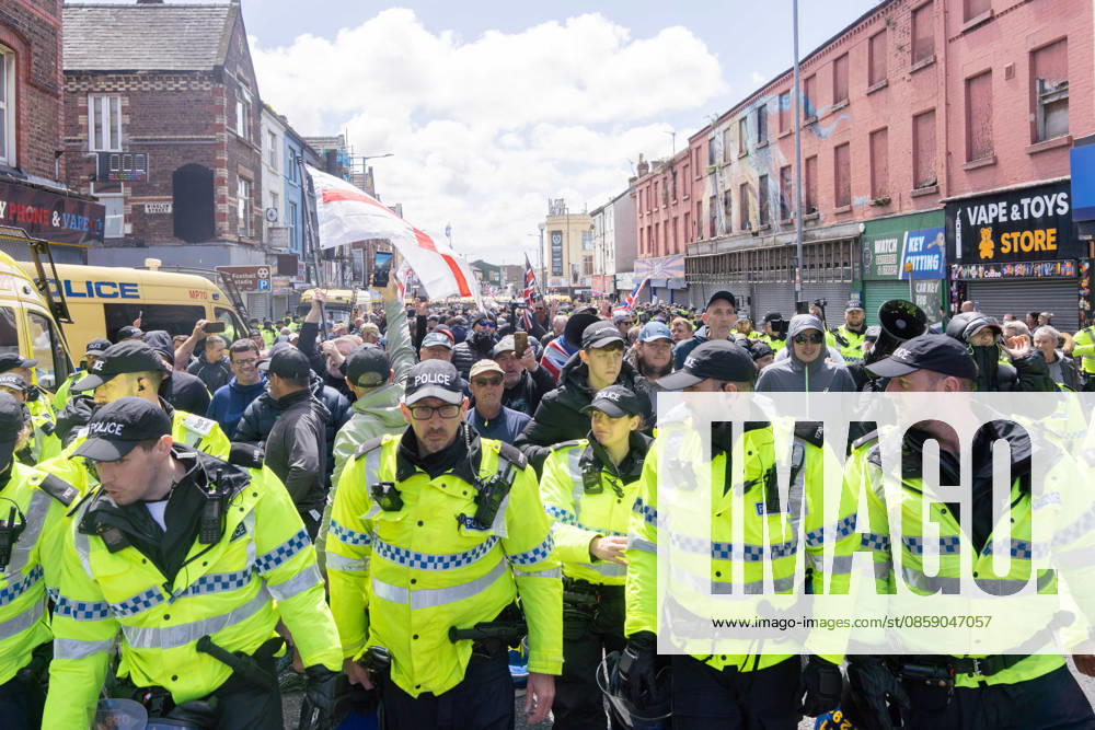 Anti-immigration protest march, Walton, Liverpool, UK, 13 June 2026. A large police presence prevents major disorder at an anti-immigration, pro-deportation protest march in Walton, Liverpool, UK, 13 June 2026., Credit:John Johnson Avalon