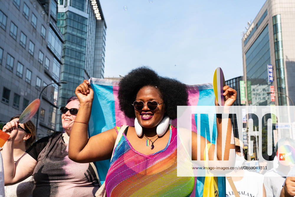A participant wearing pride flags colored clothes holds a pride flag during the Seoul Queer Parade in Seoul downtown. The 27th Seoul Queer Parade (SQP) was held in Seoul, South Korea..It is a public cultural event held downtown every year to promote LGBTQIA+ visibility, human rights, cultural enjoyment, and pride. Seoul South Korea - ZUMAs197 20260613_aaa_s197_185