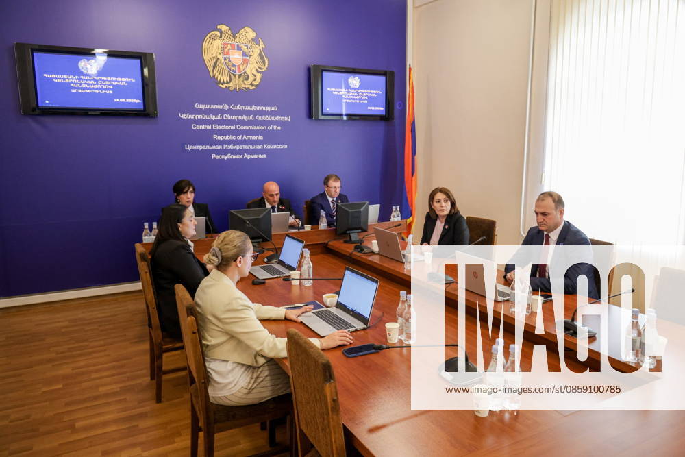 ARMENIA, YEREVAN - JUNE 14, 2026: President of the Central Election Commission of Armenia Vahagn Hovakimyan (C back) is seen in the offices of the Central Electoral Commission of Armenia during the announcement of the results of the 2026 Armenian parliamentary election Yerevan Armenia - ZUMAt113 20260614_zaa_t113_086