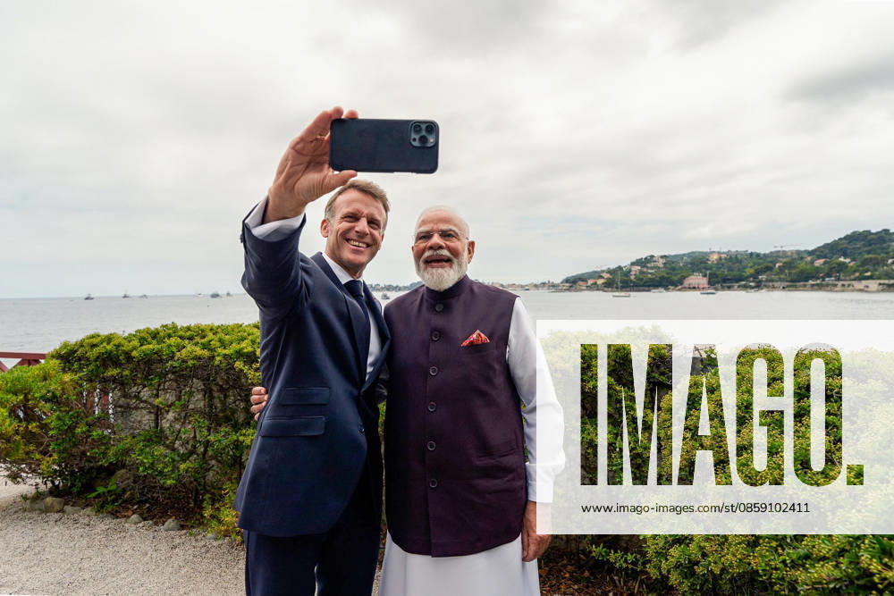 President Emmanuel Macron clicks a selfie with PM Modi at Villa Kerlyos Nice France , Jun 14 (ANI): French President Emmanuel Macron clicks a selfie with Prime Minister Narendra Modi at Villa Kerlyos, in Nice on Sunday. (@Elysee X ANI Photo) Nice France
