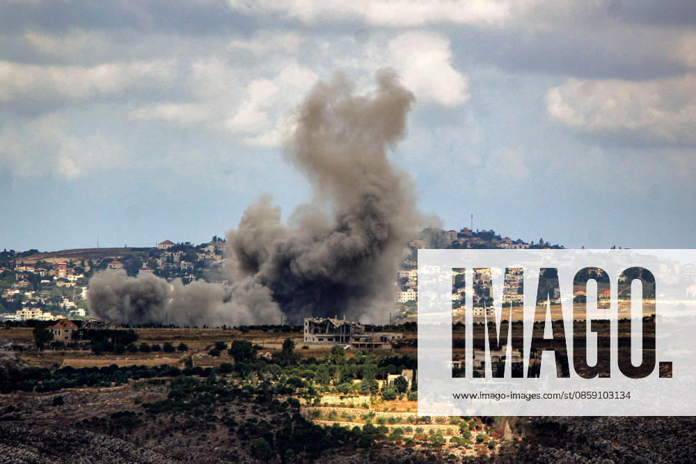 Smoke billows from Israeli air strikes from the southern Lebanese village of Kfar Tebniet on the outskirts of the major city of Nabatieh. The Israeli army issued warning to evacuate 29 villages and towns in southern Lebanon as it continued its ground advance making the deepest incursion into Lebanese territory in over a quarter of a century. Troops have established a presence on the suburbs of Nabatieh after seizing several strategic points. Kfar Tebniet Lebanon - ZUMAn313 20260614_zip_n313_001