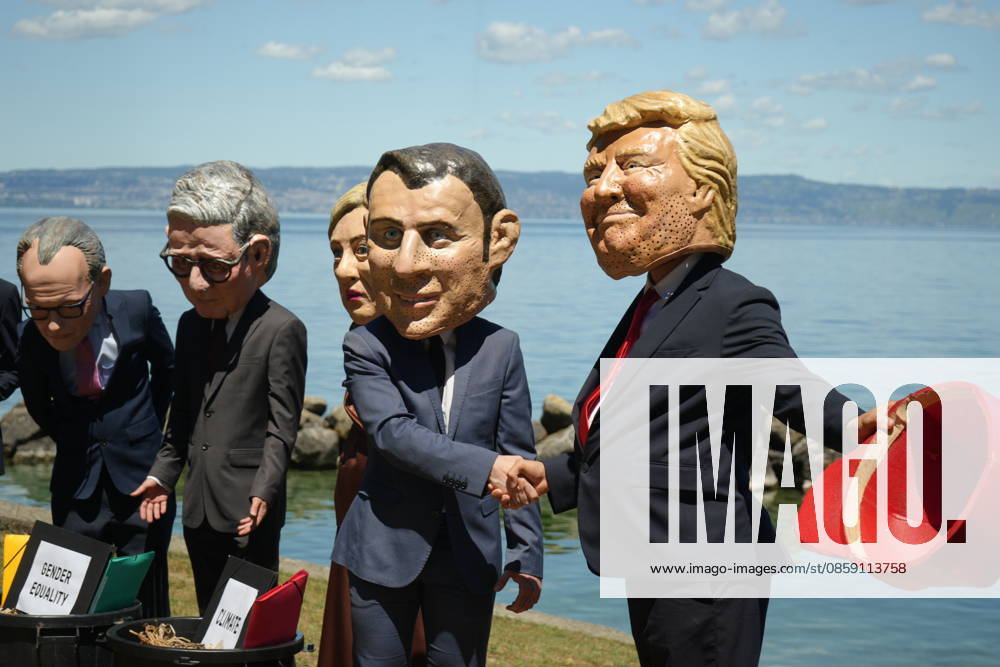 #2 Oxfam protest ahead of G7 Summit in France EVIAN-LES-BAINS, FRANCE - JUNE 14: Activists wearing oversized papier-mache masks depicting world leaders, including U.S. President Donald Trump and French President Emmanuel Macron, take part in an Oxfam demonstration ahead of the G7 Summit in Evian-les-Bains, France, on June 14, 2026. The anti-poverty charity staged the protest to call attention to climate change and gender equality issues ahead of the gathering of G7 leaders. Stringer Anadolu Evian-les-Bains France. Editorial use only. Please get in touch for any other usage.