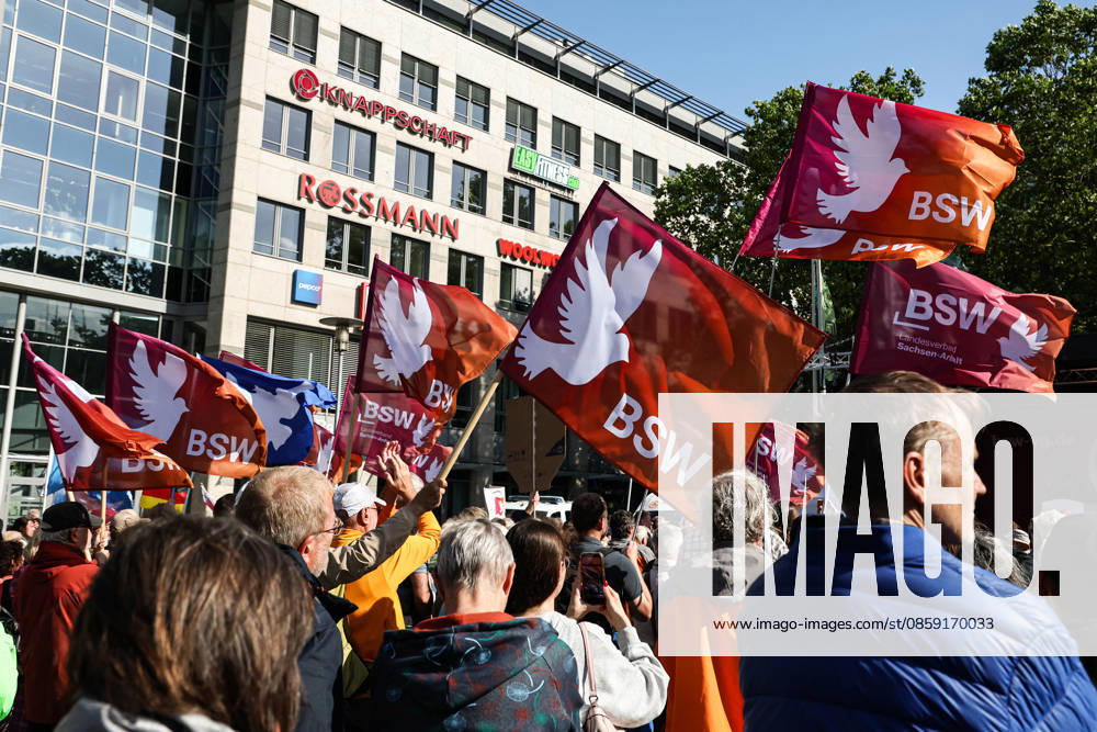 Participants in the rally with flags from the BSW BSW rally in Magdeburg Saxony-Anhalt on Willy Brandt Platz at the main railway station under the motto, World Cup 2026 Away with Merz