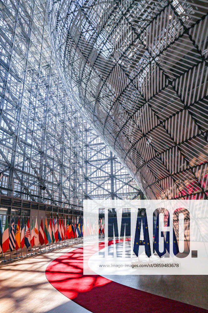 Sunlight shines through and reflects abstract shadows and flags are seen inside the Europa building at the European Council in Brussels ahead of the European Council Summit. Brussels European Union - ZUMAo116 20260618_znp_o116_001