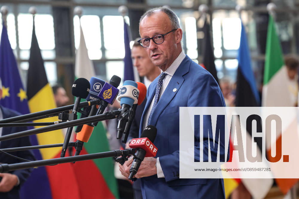 FRIEDRICH MERZ, Chancellor of Germany, walks out to greet the press ahead of a roundtable meeting during the first night of the European Council Summit in Brussels. Germany is expected to focus on competitiveness, defence readiness, migration, economic security and the blocâ€⠢s next long-term budget, alongside wider discussions on Ukraine and the Middle East. Brussels European Union - ZUMAo116 20260618_znp_o116_065