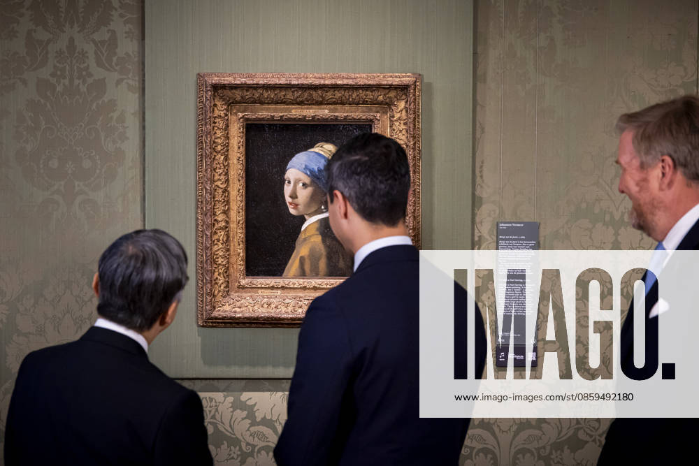 Statevisit King Willem-Alexander and Emperor Naruhito of Japan and Prime Minister Rob Jetten posing in front of the painting a Girl with a Pearl Earring by Johannes Vermeer (Meisje met de Parel van Johannes Vermeer) at the Mauritshuis in The Hague on the 2nd day of the 3 day statevisit to the Netherlands. Â