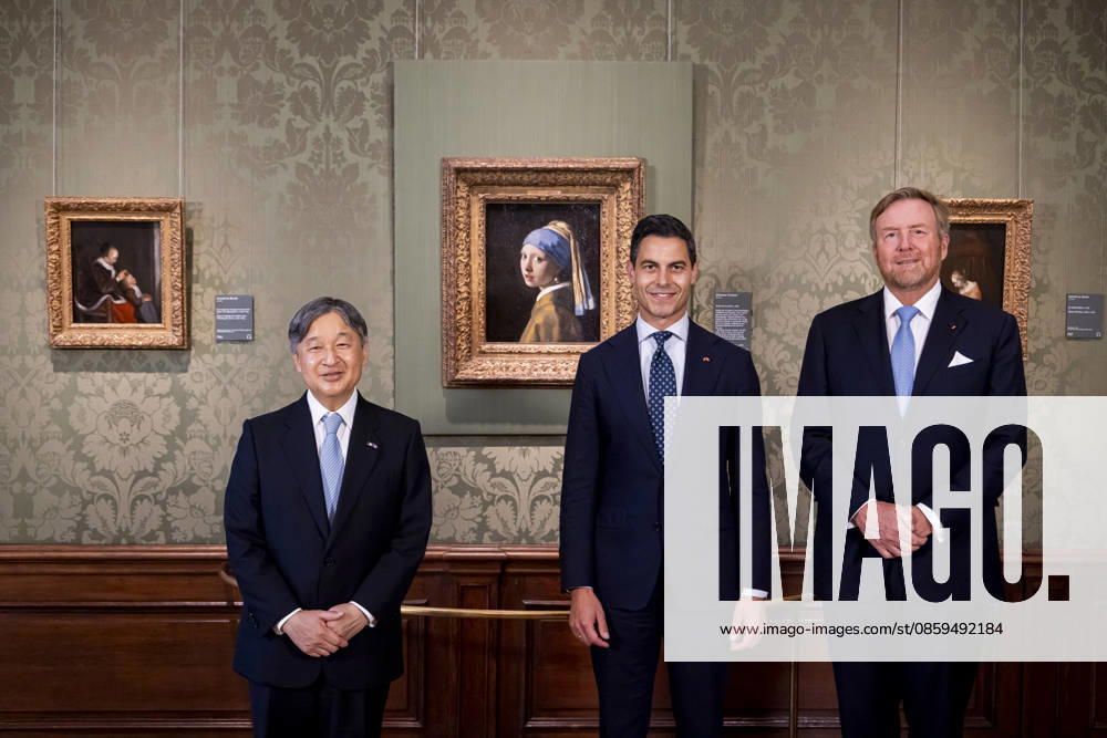 Statevisit King Willem-Alexander and Emperor Naruhito of Japan and Prime Minister Rob Jetten posing in front of the painting a Girl with a Pearl Earring by Johannes Vermeer (Meisje met de Parel van Johannes Vermeer) at the Mauritshuis in The Hague on the 2nd day of the 3 day statevisit to the Netherlands. Â