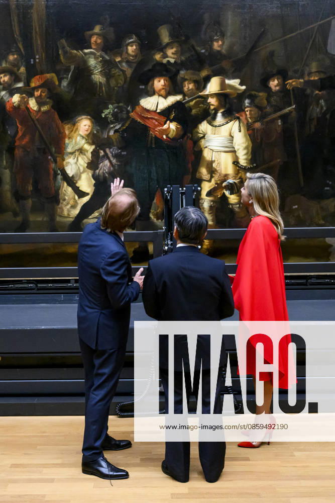 Amsterdam Queen Maxima and Emperor Naruhito of Japan and Taco Dibbits watching the Nachtwacht (The Night Watch by Rembrandt van Rijn) while visiting the Rijksmuseum in Amsterdam on the 2nd day of the 3 day statevisit to the Netherlands. Â