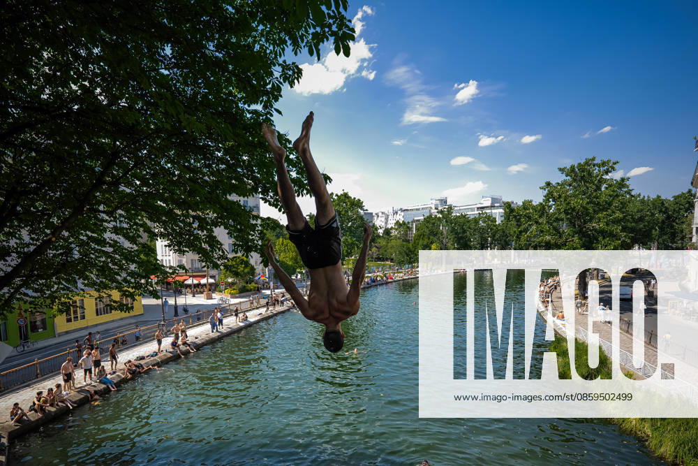 (260618) -- PARIS, June 18, 2026 -- A man jumps into the Saint-Martin Canal to cool off during hot weather in Paris, France, June 18, 2026. (Photo by Xinhua) FRANCE-PARIS-HEATWAVE AurelienxMorissard