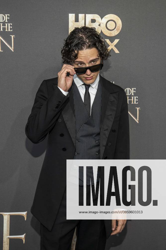 ABB HBO Harry Collett, wearing sunglasses, walked the red carpet at the German premiere of the third season of the HBO Original series House of the Dragon at Kino International on June 19, 2026, in Berlin, Germany,detected_source_language