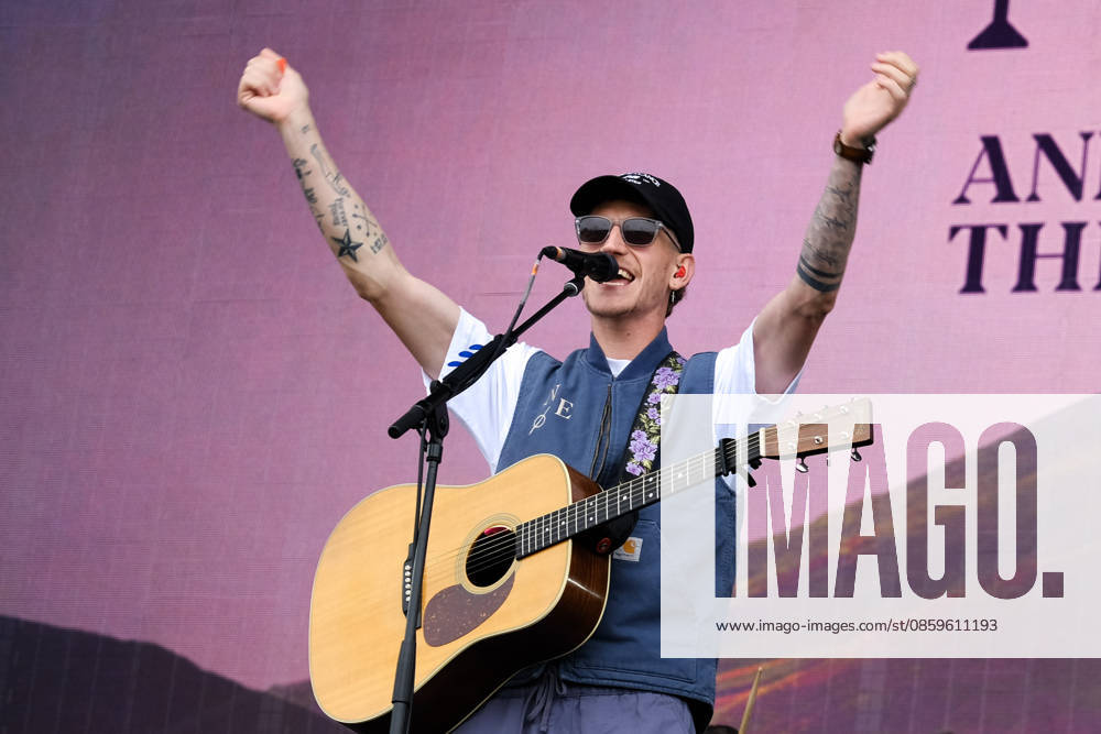 Scottish singer songwriter Nathan Evans born Nathan Alexander Evans, performing live on stage with The Saint PHNX Band at the Isle of Wight festival. He first gained fame in 2020 by posting videos of himself singing sea shanties on TikTok. In 2021, he released a version of the folk song Wellerman which peaked at the top of the UK Singles Chart. The Saint PHNX Band is currently Nathan Evans Lead vocals and acoustic guitar., Stevie Jukes Lead vocals, guitar, and bass, Alan Jukes Backing vocals, drums, and percussion Newport United Kingdom - ZUMAs197 20260620_aaa_s197_146