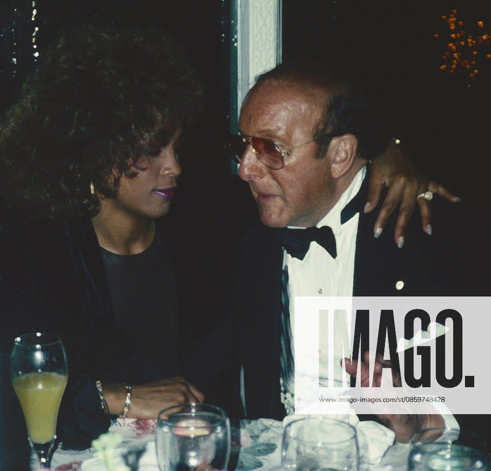 Whitney Houston and Clive Davis attend Arista AIDS Party at Tavern on the Green in New York City on March 17, 1990. Photo