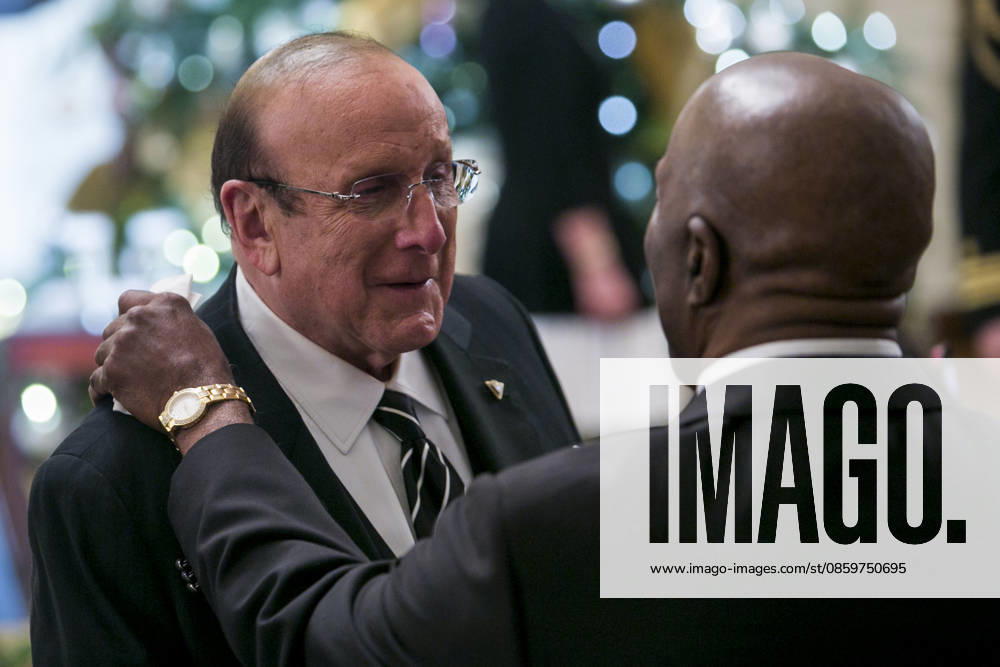 Clive Davis, left, and Buddy Guy, right attend a reception at the White House for the 2013 Kennedy Center Honorees on December 8, 2013 in Washington, DC. The honorees this year include: opera singer Martina Arroyo, jazz musician Herbie Hancock, musician Billy Joel, actress Shirley MacLaine and musician Carlos Santana.