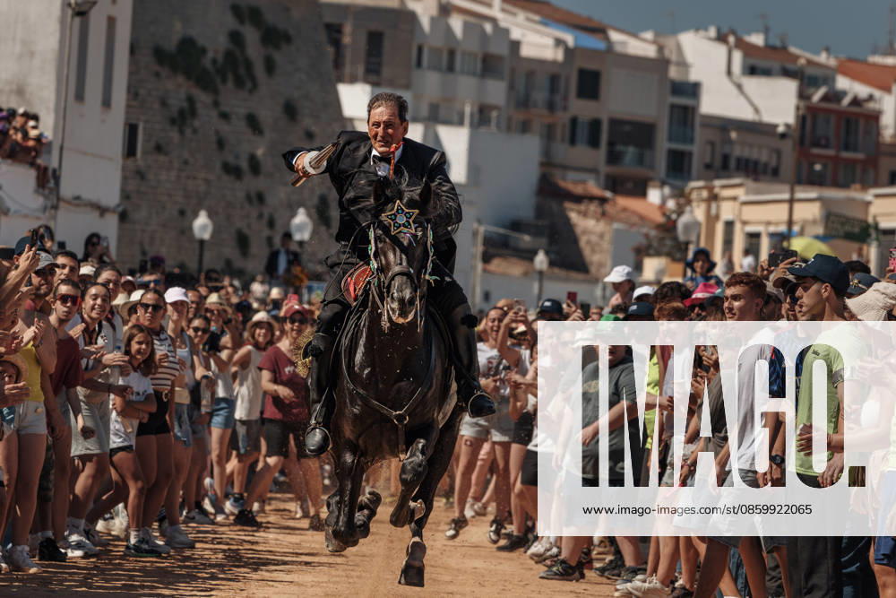 A caixer (horse rider) aims his lance at a suspended ring during the training session for the Jocs des Pla (medieval tournament) during the traditional Sant Joan (Saint John) festival in Ciutadella de Menorca Ciutadella Spain - ZUMAo105 20260624_fap_o105_001