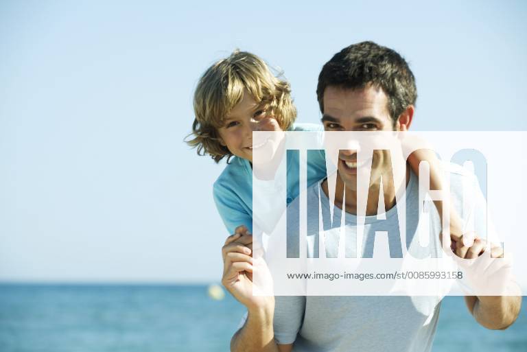Father and son together at the beach, portrait