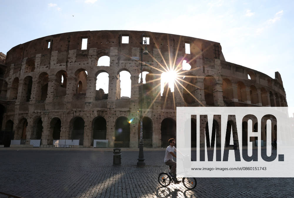 (260627) -- ROME, June 27, 2026 -- A man rides past the Colosseum in the morning in Rome, Italy, June 26, 2026. Many Rome residents and tourists opt for outdoor activities after sunset to avoid the scorching sun amid an ongoing heatwave in the Italian capital. ) ITALY-ROME-HEATWAVE LixJing
