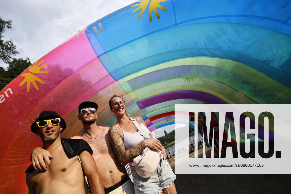 Visitors in front of a rainbow tunnel at the 2026 Rainbow Festival at Fühlinger See. Markus Krampe s Rainbow Festival takes place as part of ColognePride. Cologne, June 27, 2026, North Rhine-Westphalia, Germany