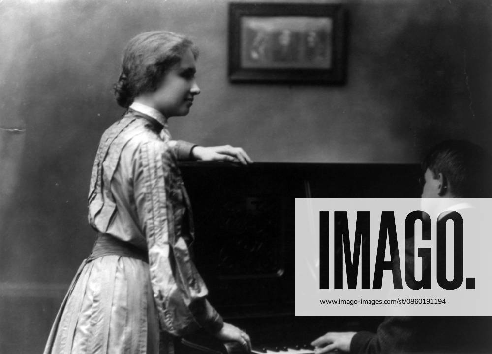 Helen Keller (1880 ? 1968), American author, political activist, and lecturer. Helen Keller at a piano, which man is playing. 1904. Helen Keller (1880 ? 1968), American author, political activist, and lecturer. She was the first deaf-blind person to earn a bachelor of arts degree. she campaigned for women s suffrage, labour rights, socialism, antimilitarism, and other similar causes. Editorial use only. All other uses to be cleared with the copyright owner (World History Archive), in advance., WHA_119_0201.jpg, Helen Keller; piano; 1904; deaf-blind; American author; political activist; lecturer; women s suffrage; labour rights; socialism; antimilitarism; bachelor of arts degree; historical figure; disability rights; s