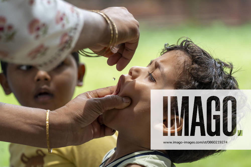 A health worker administers oral polio vaccine drops to a child during a immunization campaign, in Guwahati, India on 28 June 2026. - ZUMAt232 20260628_zip_t232_003