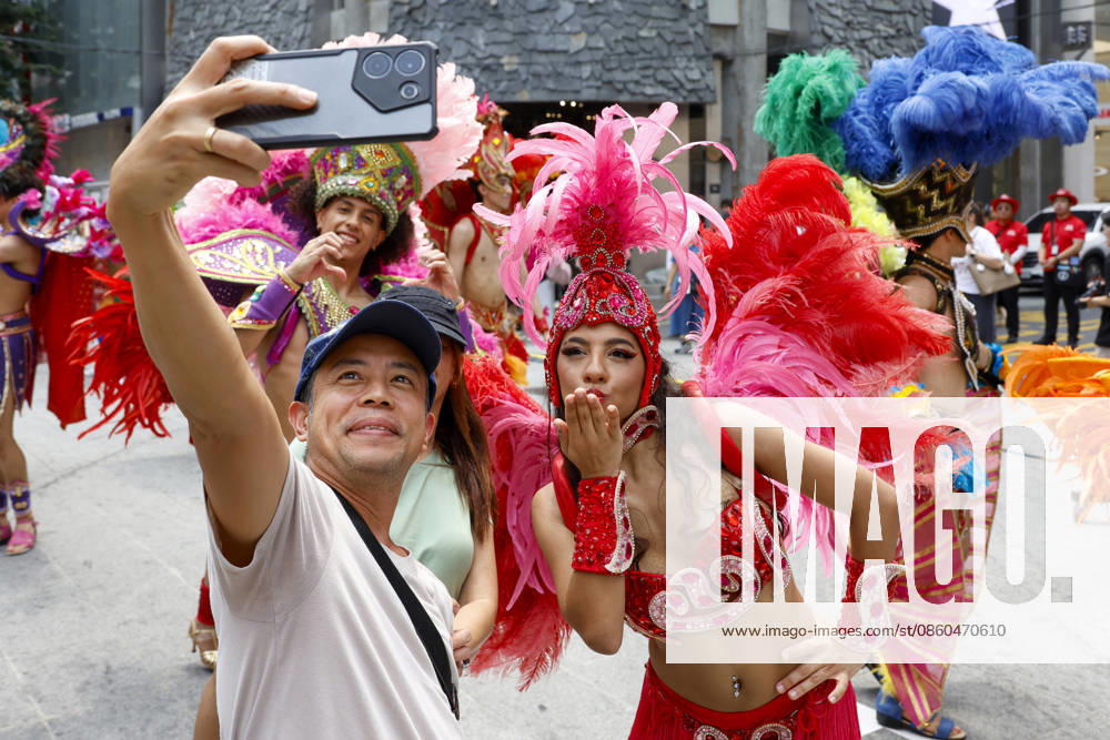 Dancers perform samba show summer festival in Seoul Dancers from Lotte World, a South Korean theme park, pose for photos with visitors after performing a samba show during a summer festival promotional event in the Myeongdong shopping district in Seoul, South Korea, on July 01, 2026. Seoul South Korea