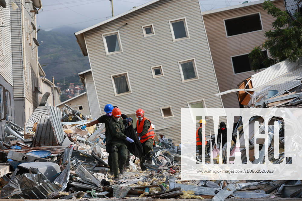 Earthquake In Venezuela Rescue workers remove a body from a collapsed building in the Hugo Chavez housing development following the earthquake that strikes Venezuela on June 30, 2026, in Catia la Mar, La Guaira, Venezuela. La Guaira Venezuela