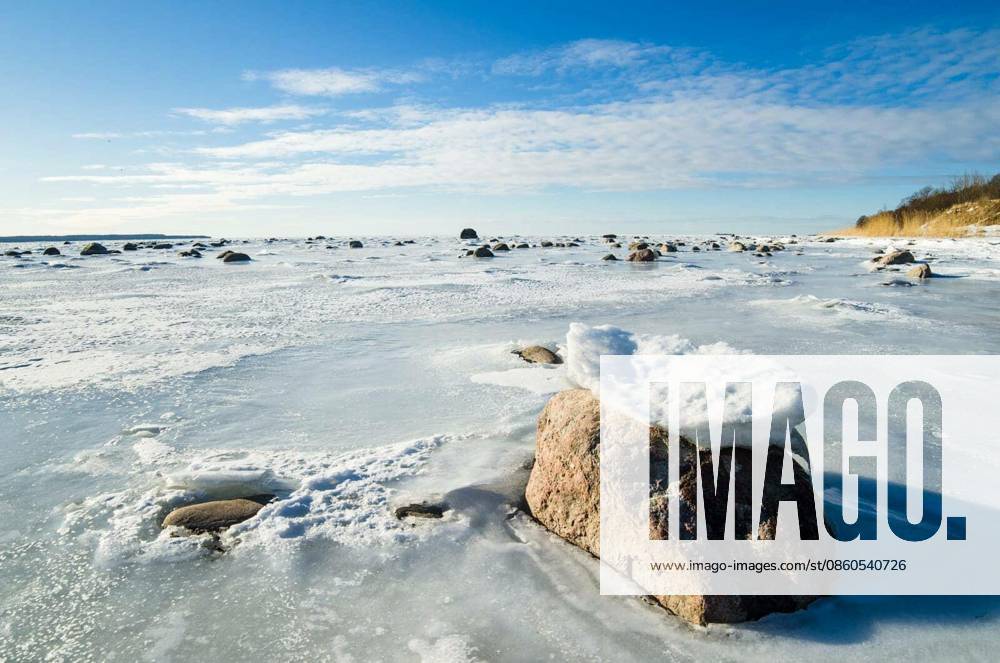 Stones in the ice on the Baltic Sea coast