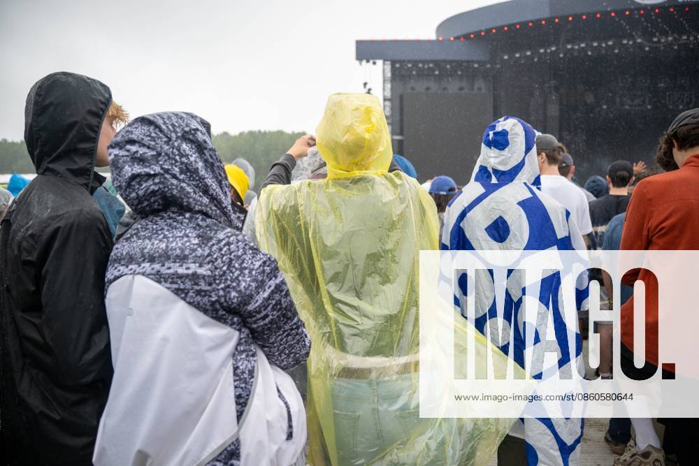 People wear rain protection during the first day of the Rock Werchter music festival in Werchter, Thursday 02 July 2026. The 51th edition of the festival is taking place from July 2 to July 5. JONASxROOSENS 180170585