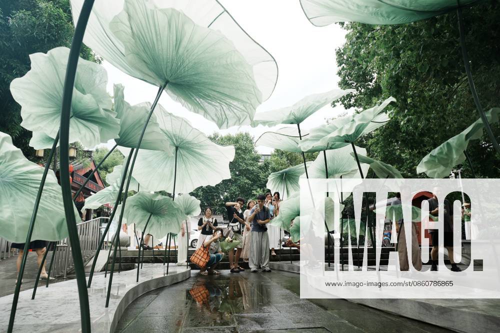 Lotus Leaf Art Installation Citizens enjoy the cool breeze under an art installation composed of giant lotus leaves in Hangzhou, Zhejiang Province, China on July 5, 2026. Hangzhou Zhejiang China