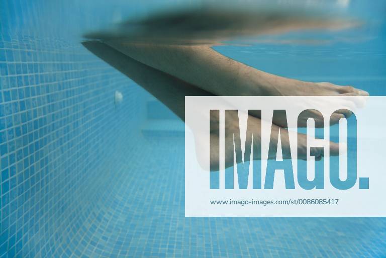 Man s legs in water, underwater view