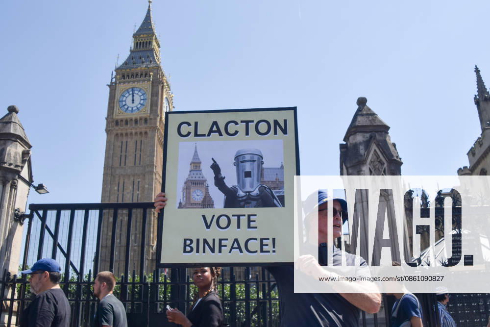 Protesters hold anti-Farage placards as the Reform leader resigns as MP for Clacton, London, UK - 8 Jul 2026 An activist holds a placard urging Clacton to vote for the satirical candidate Count Binface during the weekly anti-Brexit and pro-EU protest in Parliament Square. Nigel Farage has resigned as MP for Clacton triggering a by-election. London United Kingdom