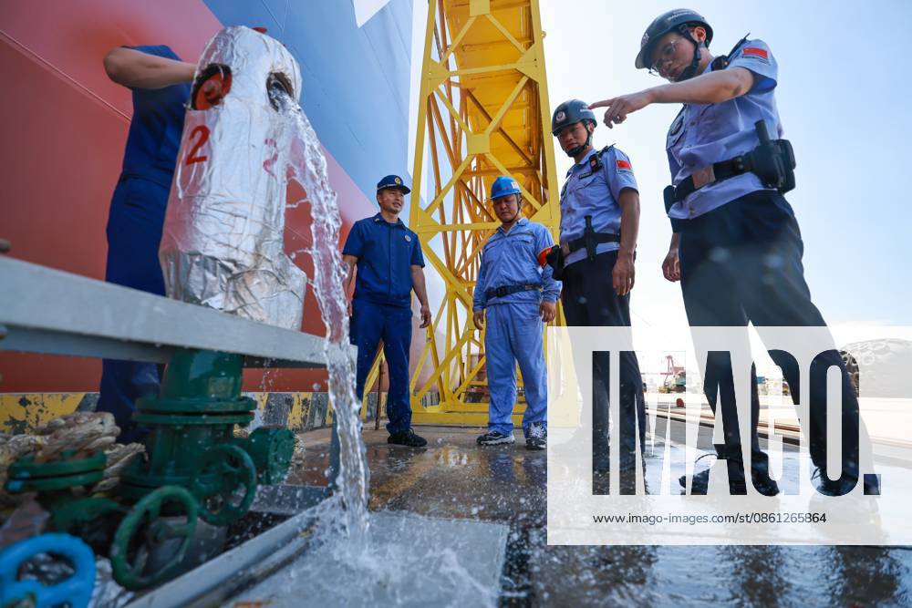 (260710) -- BEIJING, July 10, 2026 -- Police officers and firefighters conduct safety inspections on fire control facilities at a wharf in Taicang, east China s Jiangsu Province, July 10, 2026. China s national observatory on Friday renewed an orange alert for Typhoon Bavi, the ninth typhoon of 2026, which is expected to bring gales and heavy rain to eastern China. Affected regions are on high alert, with all prevention and response measures fully implemented to safeguard people s lives and property. (Photo by Xinhua) CHINA-TYPHOON BAVI-PREVENTION (CN) ShaoxZhijia