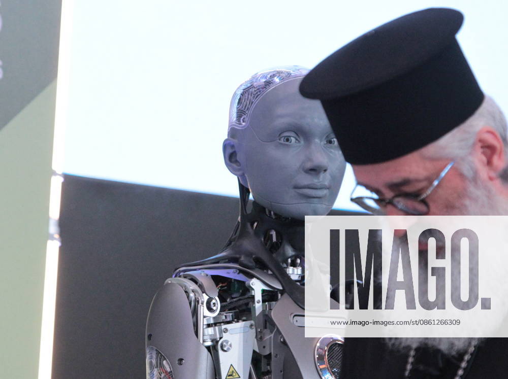 AMECA robot speaks with one philosopher and one preast at 30th Annual Government Roundtable Economist conference. Ameca is the worldâ€⠢s leading social humanoid robot, created by UK robotics company Engineered Arts. First unveiled in 2021, Ameca was designed for advanced, natural and engaging human-robot interaction, combining artificial intelligence, expressive and realistic facial movements, and lifelike gestures. Athens Greece - ZUMAv62_ 20260710_zaf_v62_020